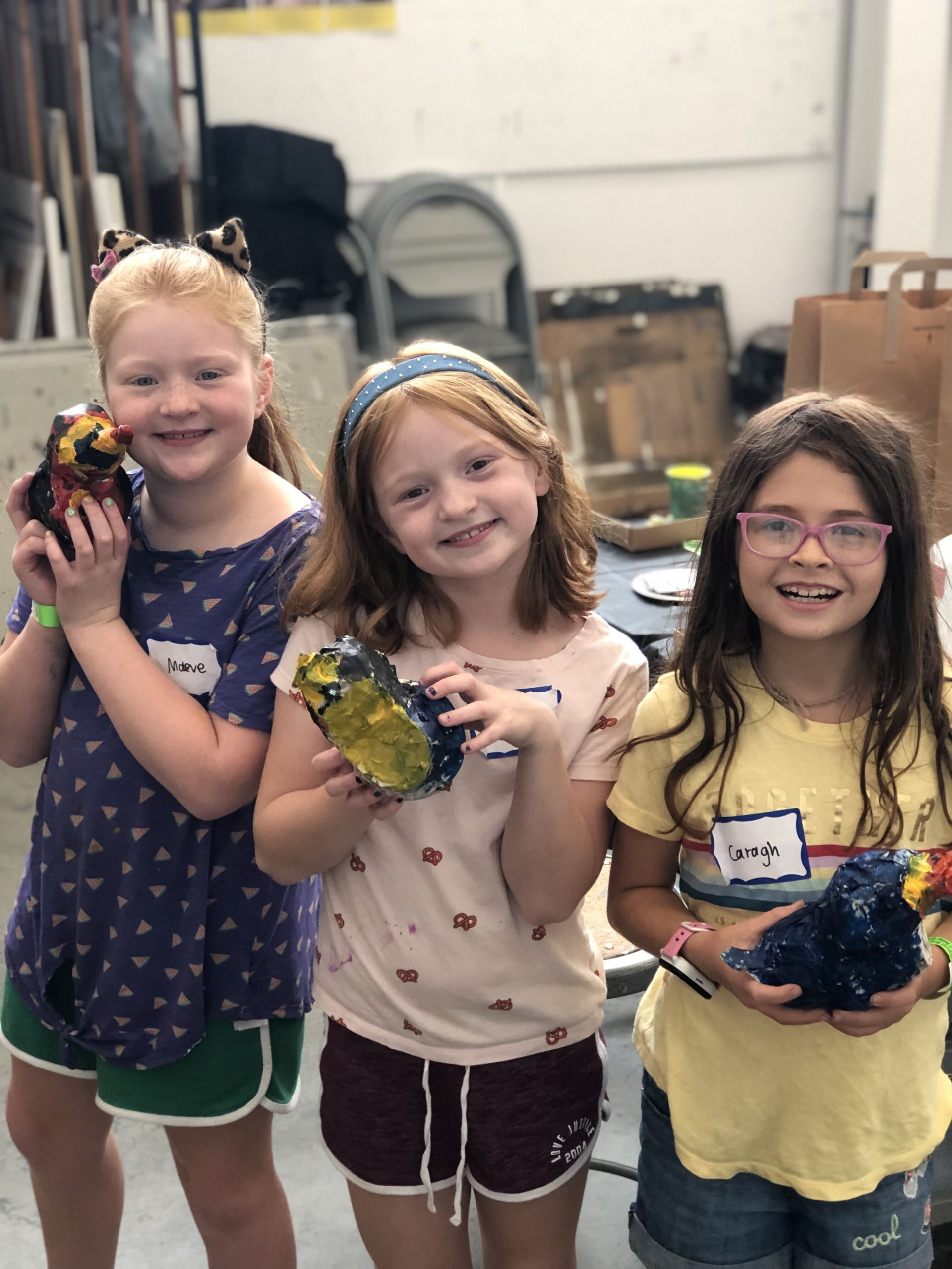 kids presenting ceramics
