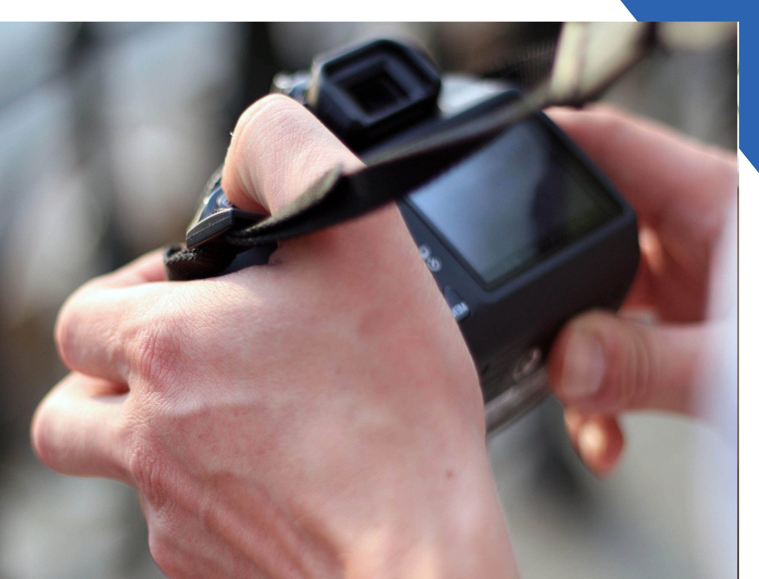 Hands holding a digital camera