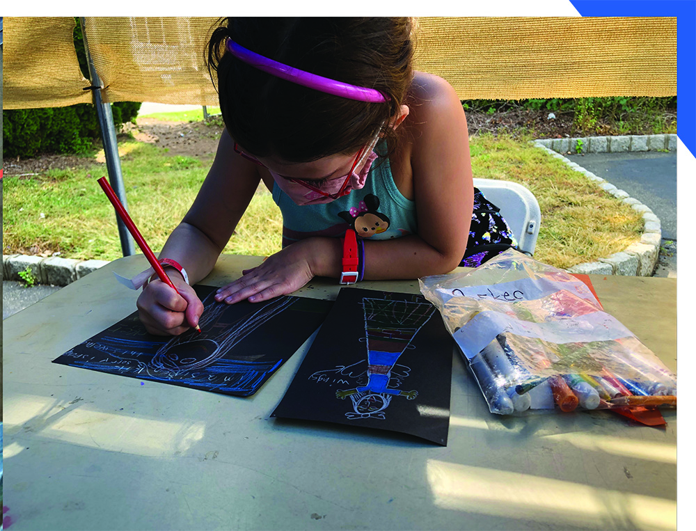 Masked Child Making Art