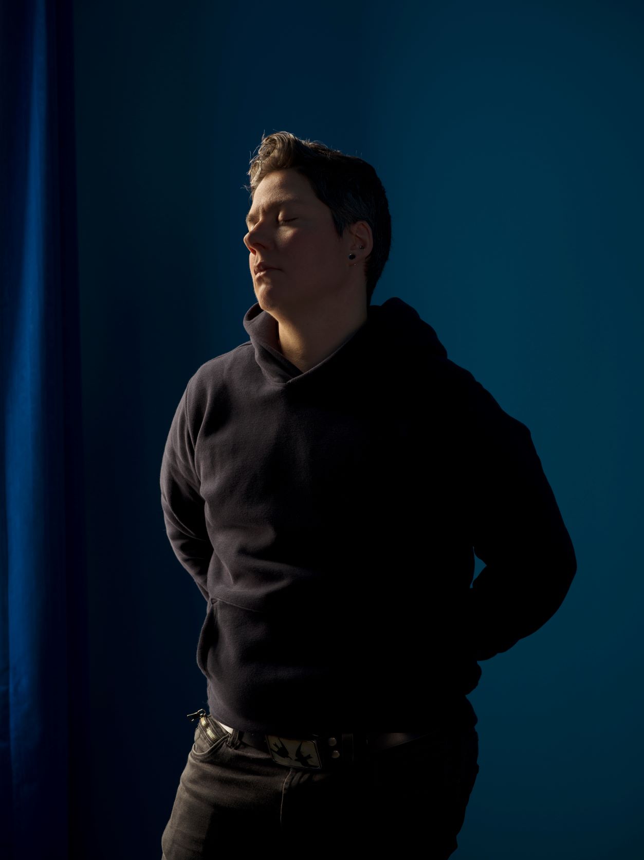 Self-Portrait (blue room) by Jess T. Dugan