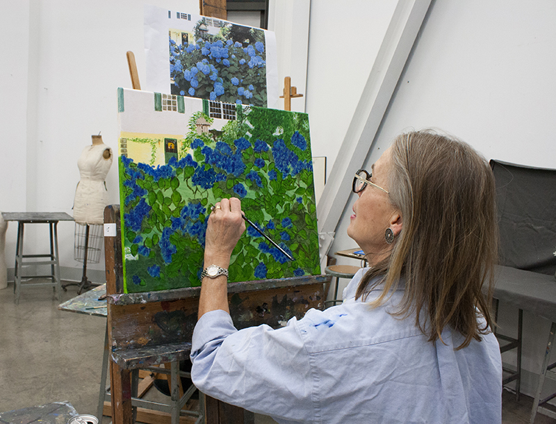 A woman painting in a VACNJ studio.