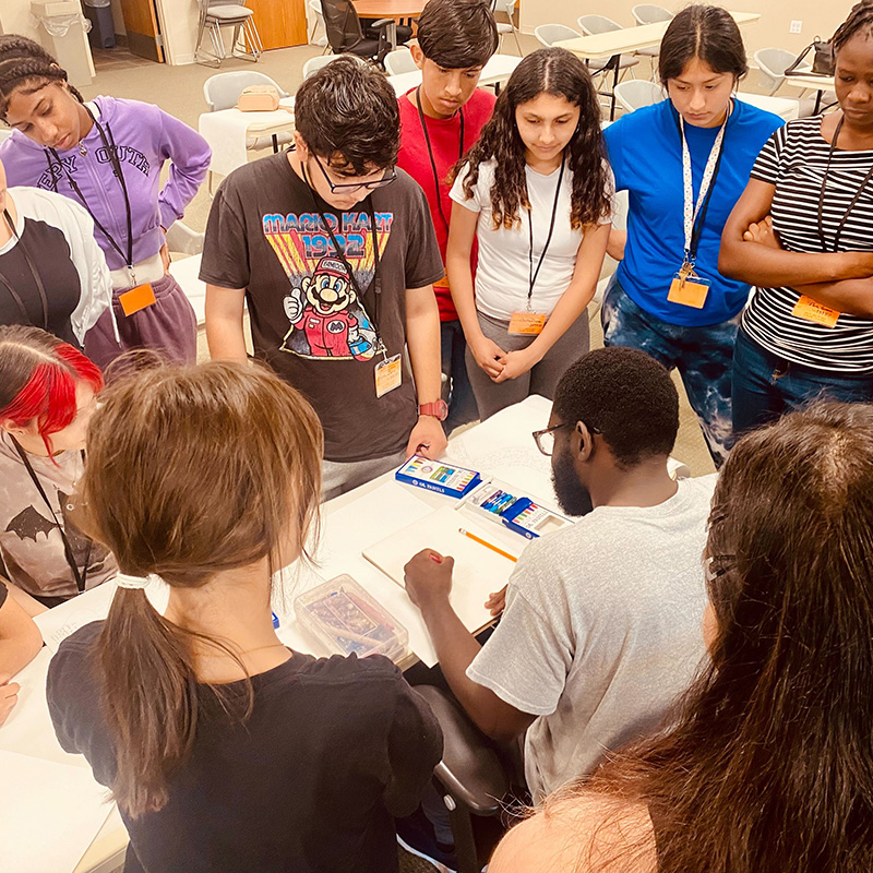 Artist in Residence Kirk Maynard demonstrating his process to visiting students.